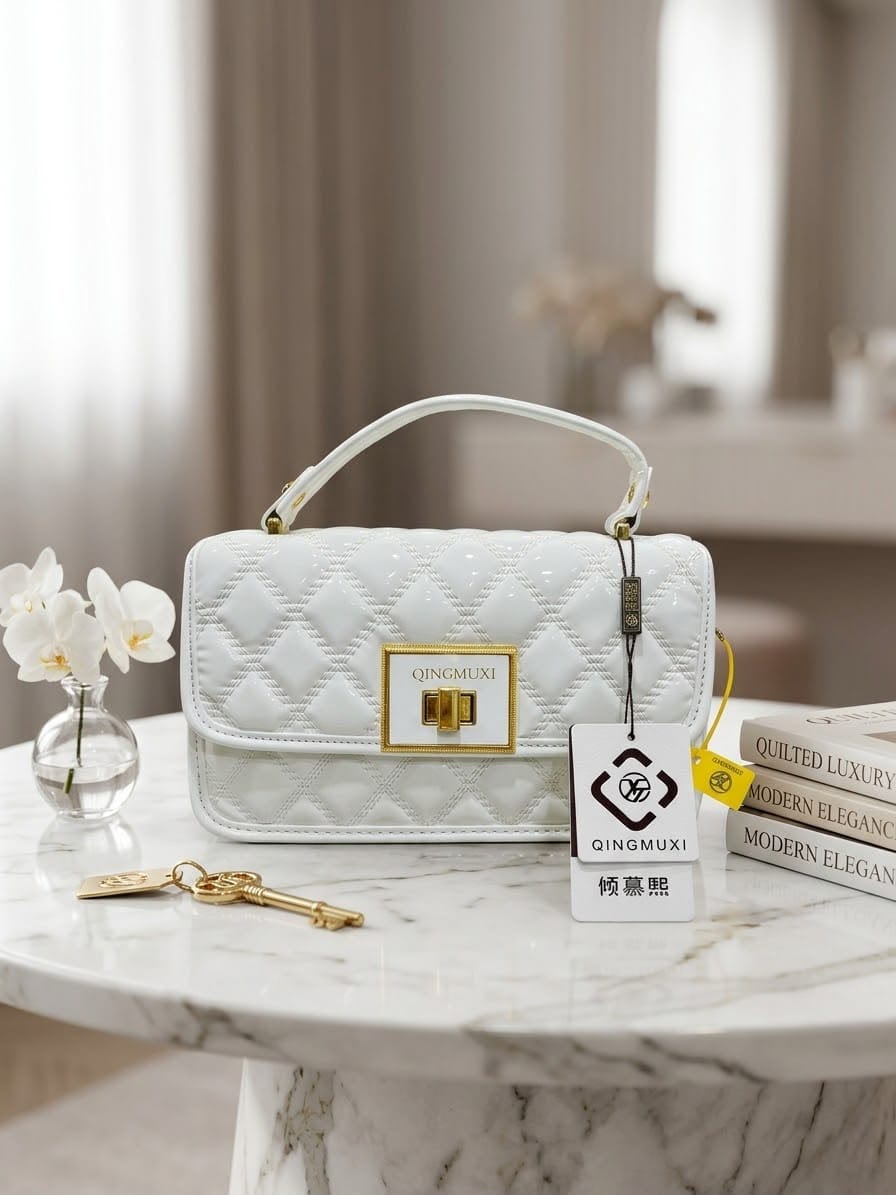 The Golden Quilted Top-Handle Bag in Pearl White